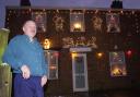 Richard outside his festive decorated home in Mile Cross