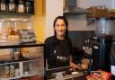 Owner Emma Risbey behind the counter at Nourish in Norwich