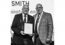 Jack Smith (left) is pictured with Norfolk FA Chairman, Michael Banham receiving an award in recognition of his 15 years' service to the Anglian Combination League at the Norfolk FA Volunteer Awards in 2023