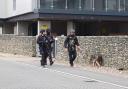 Armed police were seen walking along Geoffrey Watling Way next to Carrow Road this morning