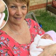 Sandra Ireson holding her newborn granddaughter Josie. Pictured: The missing wedding ring.