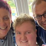 Maisie Lossau, 16, with her parents Dawn and Darrell at their Spixworth home