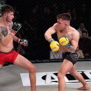 Chey Veal, right, tries to land a right hand on Duncan Djillali in their bantamweight title clash at Road to Contenders. Picture: BRETT KING