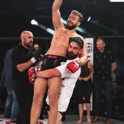 Norfolk's Scott Butters hoists Kim Thinghaugen in the air after he had inflicted the first defeat of Butters' pro career on the lightweight prospect at Contenders 24. Picture: BRETT KING