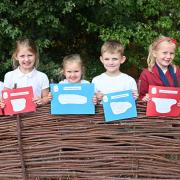 Year 2 at Cecil Gowing Infant School  with letters they have written for King Charles III. Pictures: Brittany Woodman