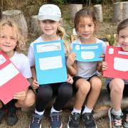 Year 2 at Cecil Gowing Infant School  with letters they have written for King Charles III. Pictures: Brittany Woodman