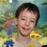 Finley Archer-Dawson with his fish tank that was donated by Darius Lapinskas from the Norfolk African Cichlid Facebook group