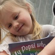 Three-year-old Mila holding a copy of My Popsi who Lives in the Rainbows, written be her mum, Madison Gilyatt (inset)