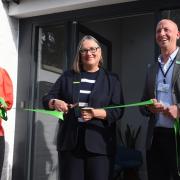 Julie Bentley (middle), chief executive of the Samaritans nationally, cuts the ribbon to open the newly refurbished Norwich Samaritans building. With her is James Ellis (right), branch manager, and Anna McNeil (left), branch operations manager