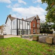 An eight-bedroom house with a corner turret and outdoor pool is for sale in Eaton