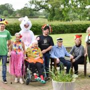 Care home residents took on a charity walk in fancy dress in aid of Macmillan Cancer Support