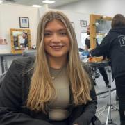 Mollie is making the cut in marketing with the support of Building Futures. Pictured: Mollie, left, and Megan at Norwich School of Hair and Beauty