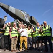 Volunteers at the RAF Cotishall Heritage Centre celebrate the arrival of the iconic Jaguar aircraft