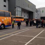 Fans loading on to Sanders Coaches for an away game