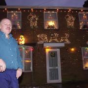 Richard outside his festive decorated home in Mile Cross