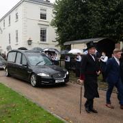 Mourners gathered to pay their respects to Richard Hughes