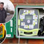 A new defibrillator has arrived in Costessey after someone damaged some life saving equipment. Inset: Costessey councillor Gary Blundell