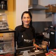 Owner Emma Risbey behind the counter at Nourish in Norwich