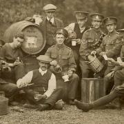 Soldiers sitting outside what was the Queen Adelade Tavern at Saxlingham Nethergate, in 1916. Photo: Submitted.