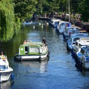 People enjoying the River Wensum in Norwich