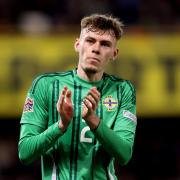 Conor Bradley applauds the Northern Ireland fans (Liam McBurney/PA)