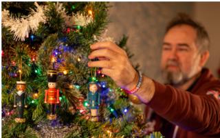 Mike decorating the Christmas tree